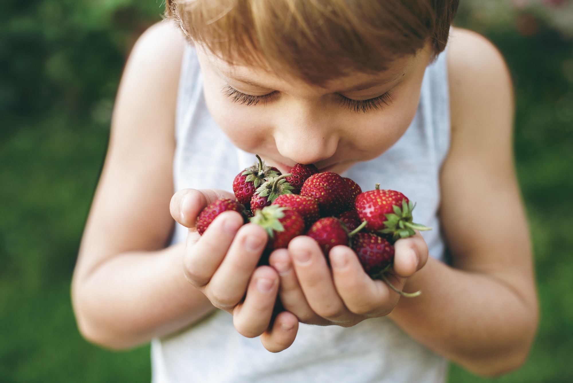 Kids being kids. Summer colorful fruit berries. Fresh clean raw